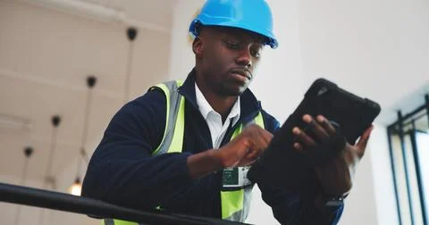 Engineer, man and scroll in office with tablet, design building or research for 写真素材