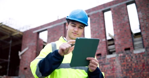 Engineer, man and typing on construction site with tablet, planning and check Stock Footage 337026124