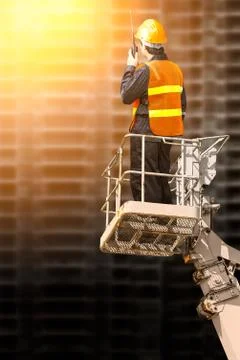 Engineer man in cabin basket Foto stock