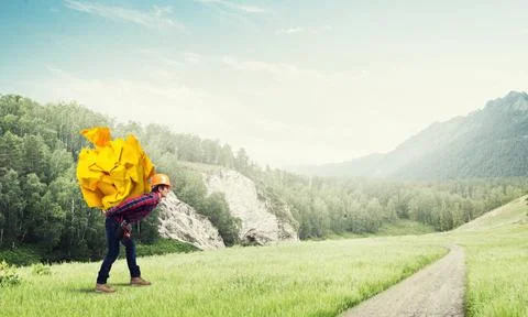 Engineer man carry load Builder man carrying paper ball on his back ,model... 库存照片