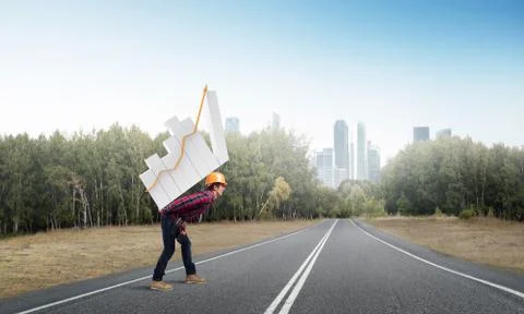 Engineer man carry progress graph Stock Photos