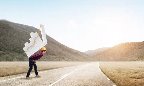 Engineer man carry progress graph Stock Photos