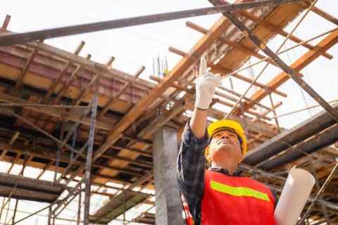 Engineer man checking and planning project at construction site 库存照片