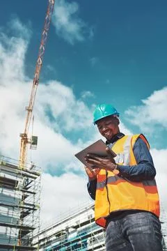 Engineer man, construction and a tablet for project management, development and Stock Photos