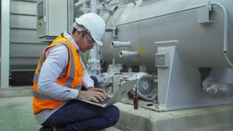 An engineer man or worker, people using a laptop computer, working in industr Stock Footage 151258698