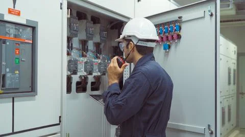 An engineer man or worker, people using a laptop computer, working in electri Stock Photos