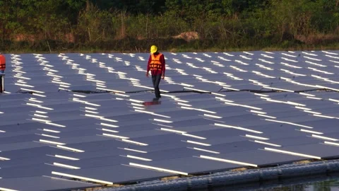 Engineer man placing solar panel on the frame Stock Footage 169808217