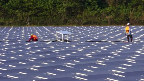 Engineer man placing solar panel on the frame Stock Footage 169808412