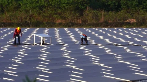 Engineer man placing solar panel on the frame Stock Footage 169808477