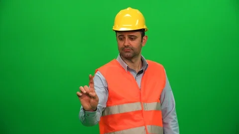 Engineer Man Touching Screen on Green Background Stock Footage 88660715