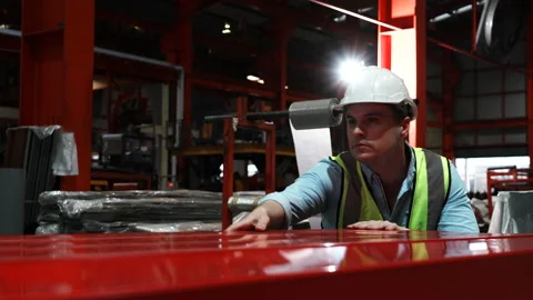 Engineer man wearing green uniform and safety white helmet under inspection Stock Footage 173356458