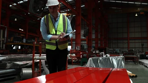 Engineer man wearing green uniform and safety white helmet under inspection Stock Footage 173357086