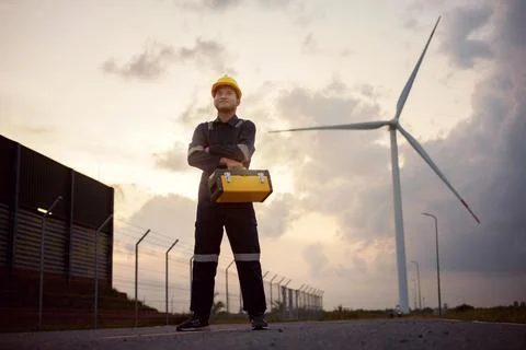Engineer man working at windmill farm generating electricity clean energy. .. Foto stock