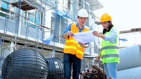 Engineer manager inspects construction sites and checking blueprints Stock Footage 96373638