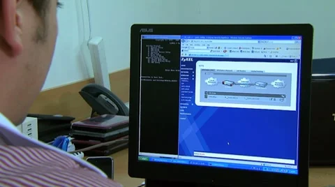 Engineer manages a network from the control room Stock Footage