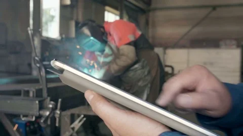 The engineer on manufacture with a tablet Stock Footage 80362420