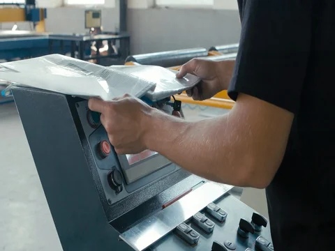 Engineer in manufacturing plant checking technical data Stock Footage 77925493