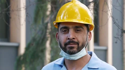 Engineer with a masked helmet is smiling at the camera. Stock Footage 132281996