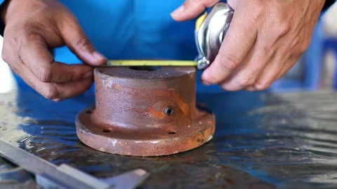 Engineer Measuring Cutting Rotor Size and Recording on Paper Stock Footage 297919753