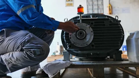  Engineer Measuring Rotor Size and Inspecting Vacuum Pump for Installation Stock Footage 297919707