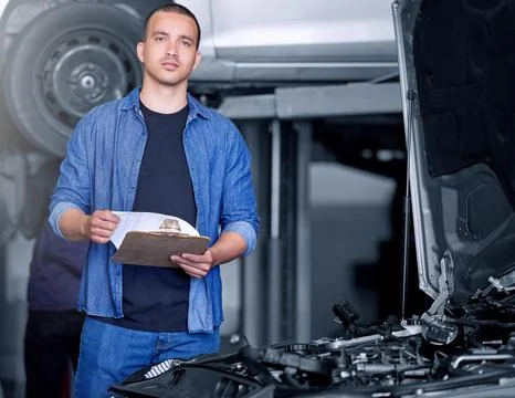 Engineer, mechanic and car engine manager with checklist working on performance Foto stock