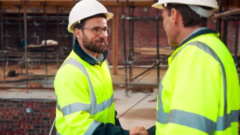 Engineer, men and handshake for construction team with collaboration, renovation Stock Footage 336223263