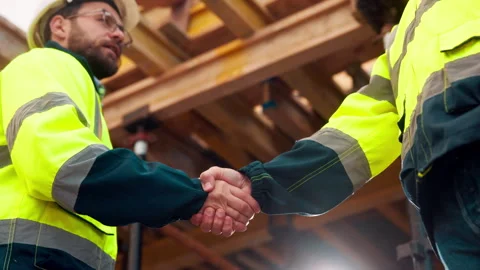 Engineer, men and shake hands for construction with collaboration, renovation or Stock Footage 336224320