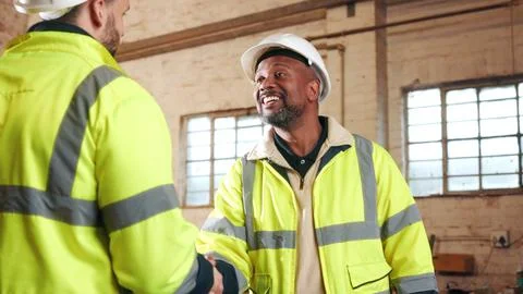 Engineer, men and shaking hands in workshop for welcome, renovation collabo.. Foto stock