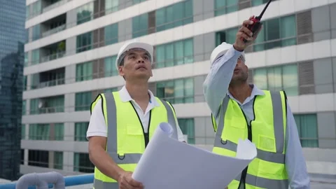 Engineer men discuss working in building Stock Footage 280732442