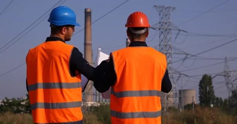Engineer Men Talking About Energy Technology Plans Power Plant Industrial Area Stock-Footage 69994523