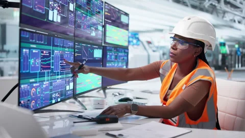 Engineer Monitors Computer Screen Controlling Automation System Stock Footage 338172422