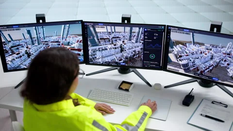 Engineer Monitors Real-time 3D SCADA Software Stock Footage 345334071