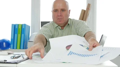 Engineer in Office Make Order in His Stuff Put in Order Charts and Diagrams Video stock 84295225