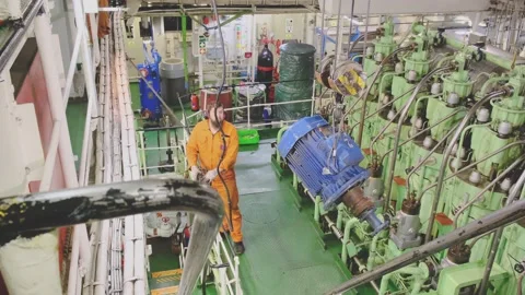 Engineer operates crane with tanker winch electric motor 動画素材 130995385