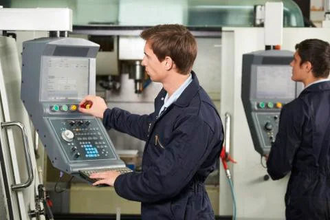 Engineer Operating Computerized Cutting Machine Stock Photos