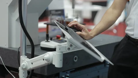 Engineer Operating Industrial Touchscreen Panel for Automated Robotic System Stock Footage 315790714