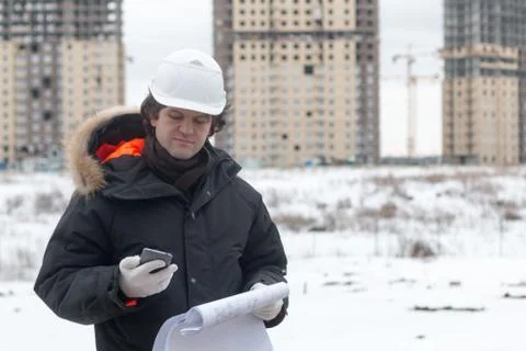 Engineer or Architect with protective safety helmet checking architectural Stock Photos