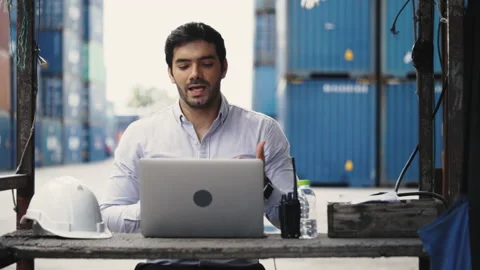 Engineer or businessmen are video call consult with friend via laptop  Stock Footage 135521171