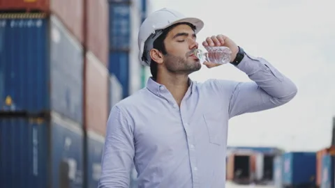 Engineer or construction worker drinking water To make the body not heat Strokes Stock Footage