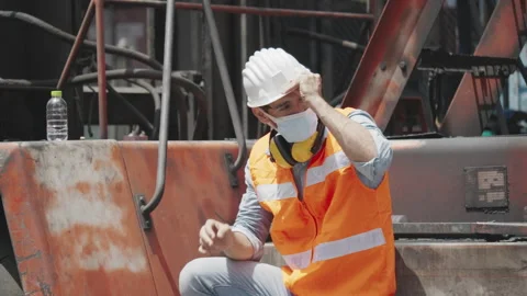 Engineer or construction worker wear safety equipment in the workplace Stock Footage 139521930