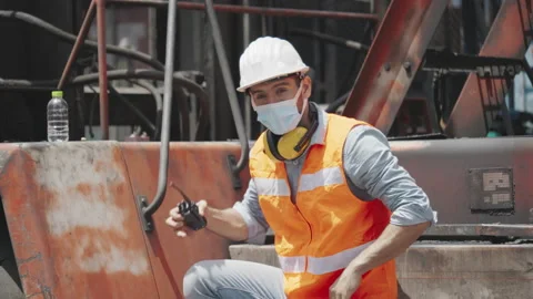 Engineer or construction worker wear safety equipment in the workplace Stock Footage 139521948