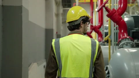Engineer Or the foreman is checking the valve and pipelines in the boiler room Stock Footage 154187639