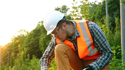 The engineer or inspector checking drawing or check sheet to identify Stock Footage 98456553