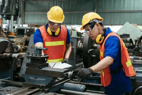 Engineer or mechanical workeron production in a factory. Stock Photos