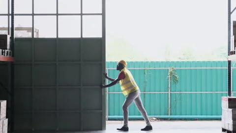 Engineer or technical open the warehouse gate Video stock 143150012