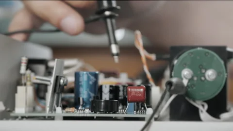 An engineer or technician tests a faulty device for breakdown. Stock Footage 284295485