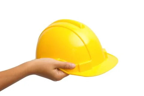 Engineer or worker hand picking yellow safety helmet hat Stock Photos