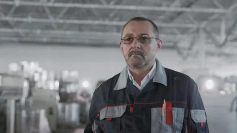 Engineer or Workman Technician Planning Work of Manufacture. Male Person in Prot Stock Footage 199475826