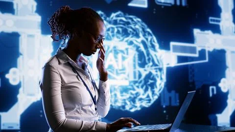 Engineer oversees AI neural network Stockfoto's