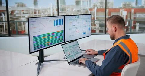 Engineer Oversees Automated Computer Systems Managing Gas And Oil Production  Stock Photos